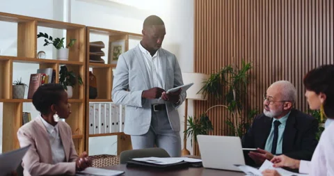 Design, proposal and tablet with business man in office boardroom for meeting or Stock Footage 330067906