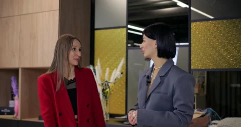 Design studio showcases creative decor ideas. Women explore fabric samples Stock Footage 276746640