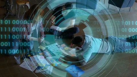 Design team arranging layouts on floor, sparking circular HUD overlay covering Stock Footage 333789817