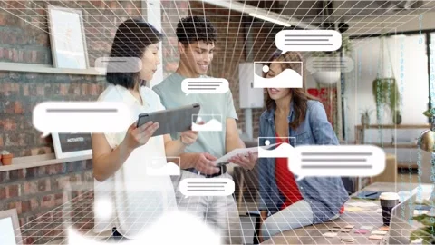 Design team collaborating at table, woman tapping tablet initiating 3D grid Stock Footage 333351187