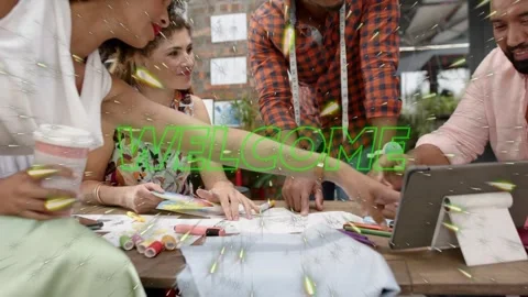 Design team laying samples lead pointing sketch when green WELCOME graphic Stock Footage 333494746