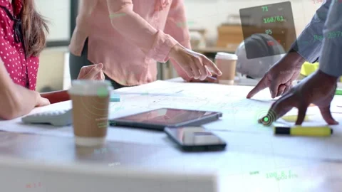 Design team leaning over blueprint center pointing while male gesturing causing Stock Footage 333063034