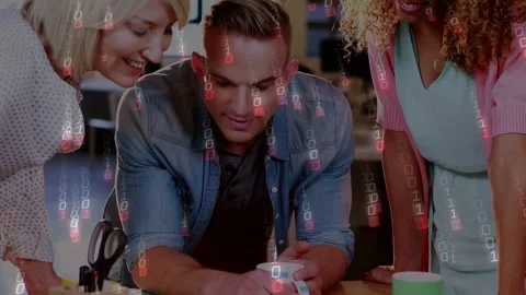 Design team leaning over table, man tapping thumbnails, choosing final layout Stock Footage 333670581