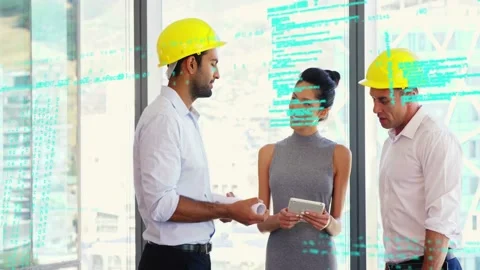 Design team showing plans, starting code overlay over group, tapping tablet, Stock Footage 333300780