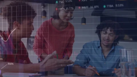 Design team sketching at table summoning digital charts showing stats refining Stock Footage 313307224