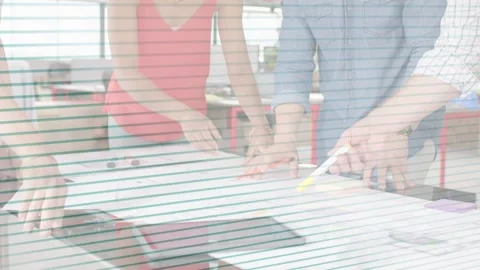 Design team smoothing blueprint, measuring and marking for layout checks with Stock Footage 332841447