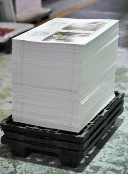 Designed, printed, stacked and ready to go. the inside of a packaging and Stock Photos