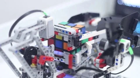 Designed robot collects Rubiks Cube Stock Footage 81787621