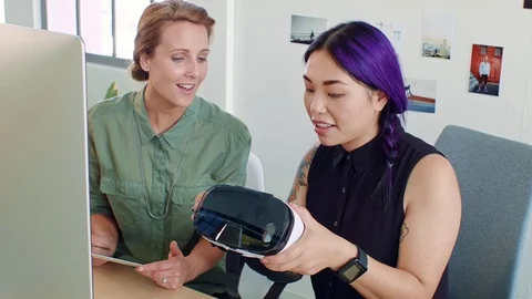 Designer and client discussing virtual simulation Stock Footage 71632507