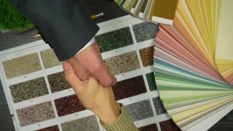 The designer and the client shake hands as a sign of agreement 動画素材 219742215