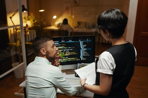 Designer and Developer Discussing Work Stock Photos