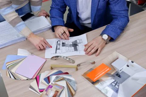 The designer approves the layout of the kitchen set made of laminated MDF and Stock Photos