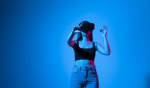 Designer, architect, engineer or developer woman stands in studio wearing VR 스톡 사진