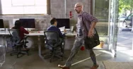 Designer Arriving For Work In Modern Office Shot On R3D Stock Footage