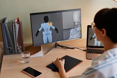 Designer building digital 3D models for videogame characters Fotos de archivo