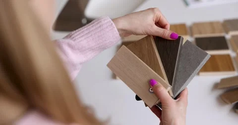 Designer choosing skirting color from samples in interior design studio Stock Footage 330673199