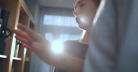 The designer with the client selects wallpaper according to the color scheme Stock Footage 82858220