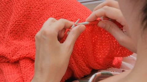 The designer of clothes manually knits a sweater. Handwork. Video stock 104887452