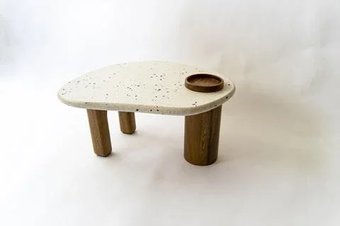 Designer coffee table, solid wood base and top in terrazzo, oak wood on white Stock Photos