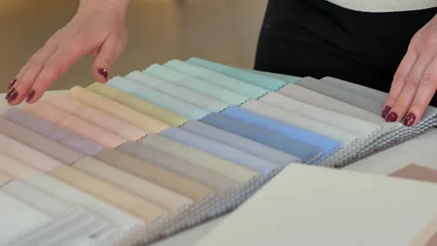 Designer decorator comparing samples of ... | Stock Video | Pond5