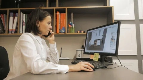 Designer designs the interior on the computer Stock Footage 117445284