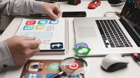Designer develop a mobile application usability and puts icons in their places. Stock Footage 128912230