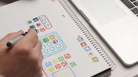 Designer develop a mobile application usability and puts icons in their places. Stock Footage 128913228