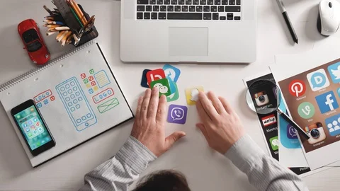 Designer develop a mobile application usability and puts icons in their places. Stock Footage 128968798
