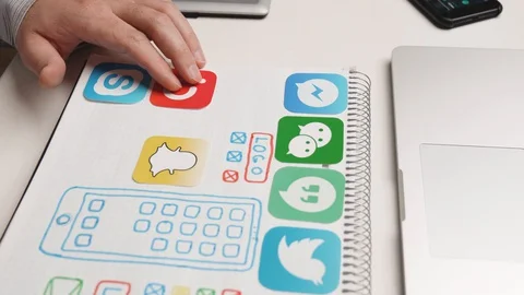 Designer develop a mobile application usability and puts icons in their places. Stock Footage 129016098