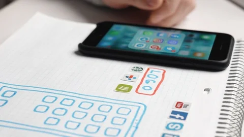 Designer develop a mobile application usability and puts icons in their places. Stock Footage 129225731