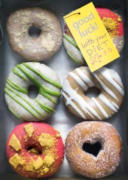 Designer Donuts with Note Stock Photos