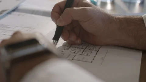 Designer drawing floor plans Stock Footage 124879124