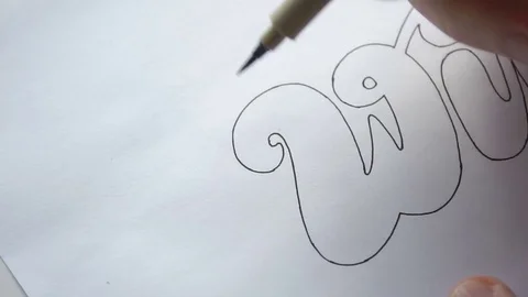 Designer drawing letters with marker Stock Footage 72222125