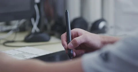 Designer Draws by Electronic Pen Stock Footage 64974489