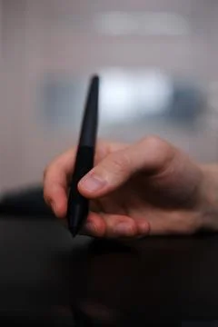 Designer draws on graphics tablet  close-up Fotos de archivo