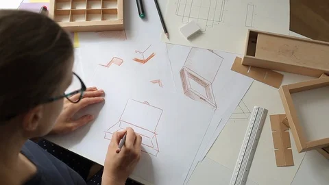 Designer draws a mockup for crafting packaging . Development of cardboard box  库存影片 116616113