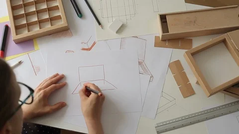 Designer draws a mockup for crafting packaging . Development of cardboard box  库存影片 116618146