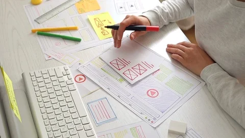 The designer draws sketches of the website. Layout development. User experience. Stock-Footage 116775459