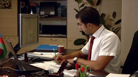 Designer draws something on paper when someone calls by phone Video stock 73363304