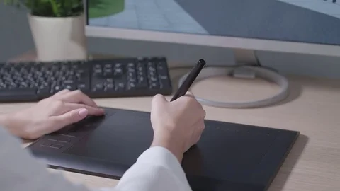 The designer draws on the tablet Stock Footage 84654551