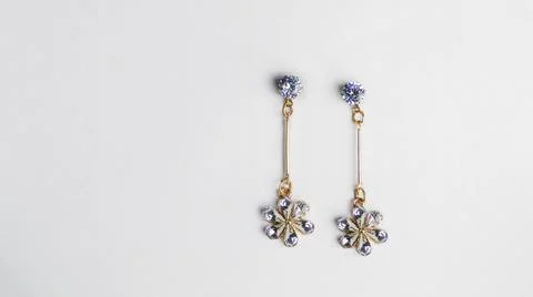 Designer Ear Stud White Gem with Golden Hanging Star Shape Stock Photos