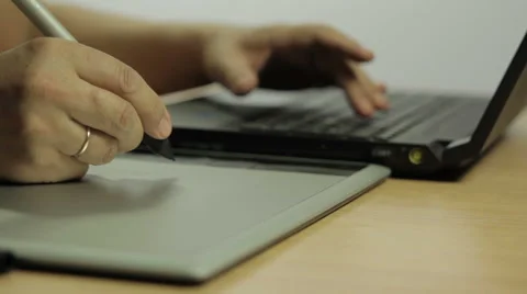 Designer edit on your computer using a graphic tablet Stock Footage 60768060