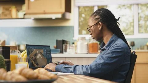 Designer engineer uses architectural software remodeling on laptop Fotos Stock