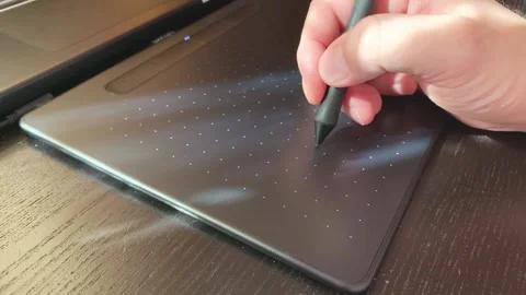 Designer Hand Drawing on a Graphic Tablet with Stylus Pen, Close Up 4K Stock Footage 318600301