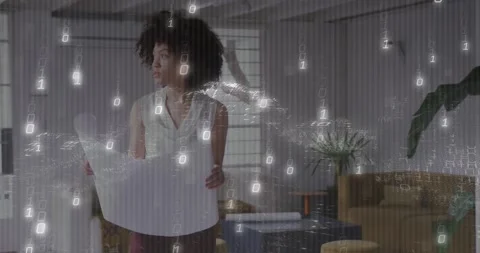 Designer holding plan, studying and starting data cloud sweeping in front for Stock Footage 334312803