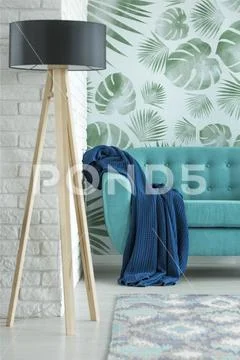 Designer lamp in floral room Stock Photos
