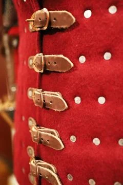 Designer leather fasteners on a jacket Stock Photos