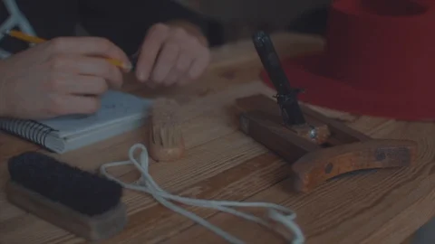 Designer makes a felt hat. Fedora hat Stock Footage 86484716