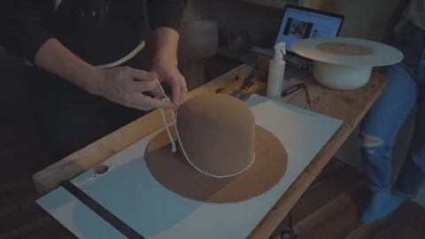 Designer makes a felt hat. Fedora hat Stock Footage 86485893