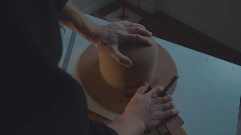 Designer makes a felt hat. Fedora hat Stock Footage 86486355